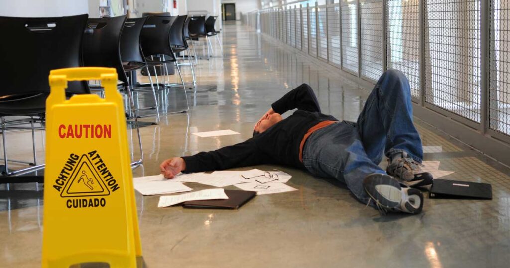 man on floor at a workplace